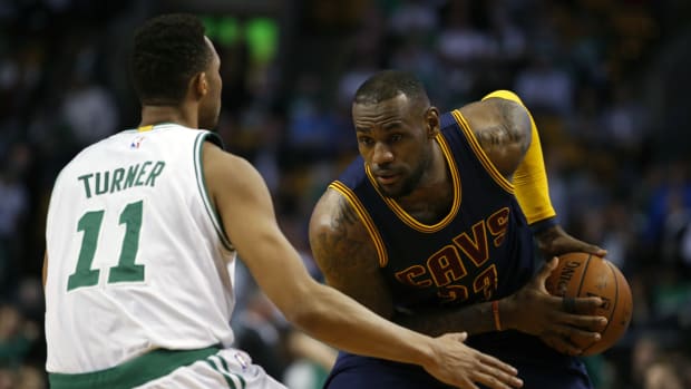 Apr 23, 2015; Boston, MA, USA; Cleveland Cavaliers forward LeBron James (23) looks for an opening against Boston Celtics guard Evan Turner (11) during the first quarter in game three of the first round of the NBA Playoffs at TD Garden.
